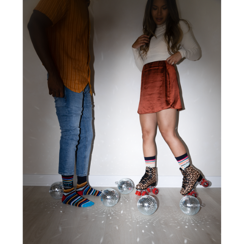 A close-up of Uptown Sox's Adulting Socks featuring funny illustrations and phrases about the challenges of adult life, perfect for anyone who can relate to the ups and downs of growing up.