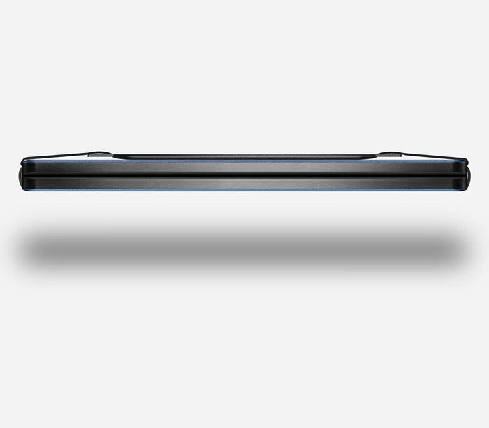 Side view of the Alpine Navy Ridge aluminum wallet showing the slim card stack profile