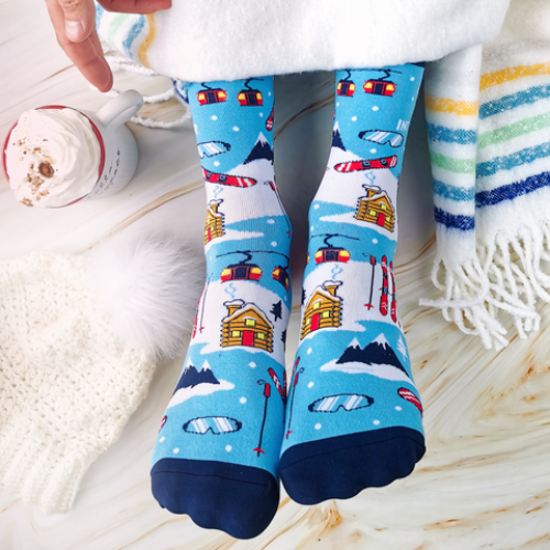 Winter socks with skis, mountains and cabins add winter fashion to any outfit.