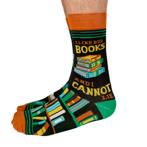 Pair of men's crew socks in orange, green, and black with a bookshelf design and the phrase 'I Like Big Books and I Cannot Lie' displayed on the side.
