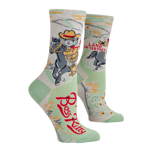 A pair of Blue Q socks featuring a confident cartoon cat with the phrase "Boss Kitty," designed with fun colors and a sassy vibe for strong, independent personalities.