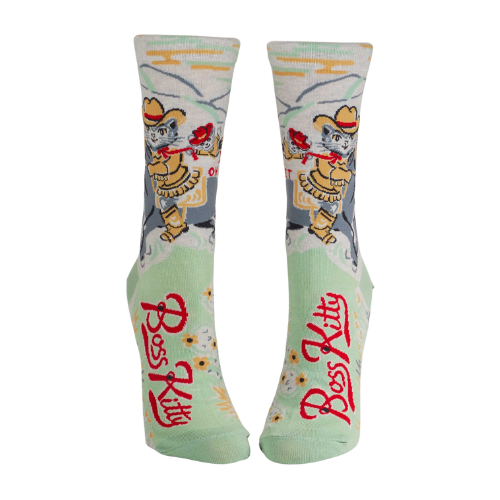 A pair of Blue Q socks featuring a confident cartoon cat with the phrase "Boss Kitty," designed with fun colors and a sassy vibe for strong, independent personalities.