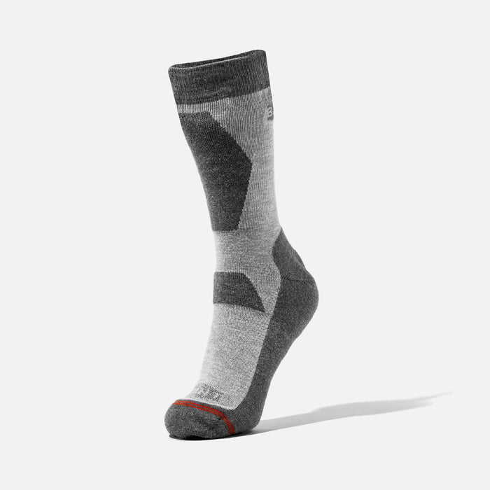 Cooling crew work socks by BRUNT in dark grey heather, two pack shown worn mid-step