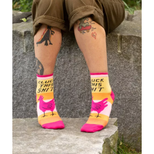 Bright horizontal wide stipes with a pink rooster on the front part with writing "cluck this shit" on ankle socks
