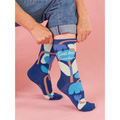 Women’s crew socks featuring the phrase ‘Cool-Ass Grandma’ in a fun, colorful design.