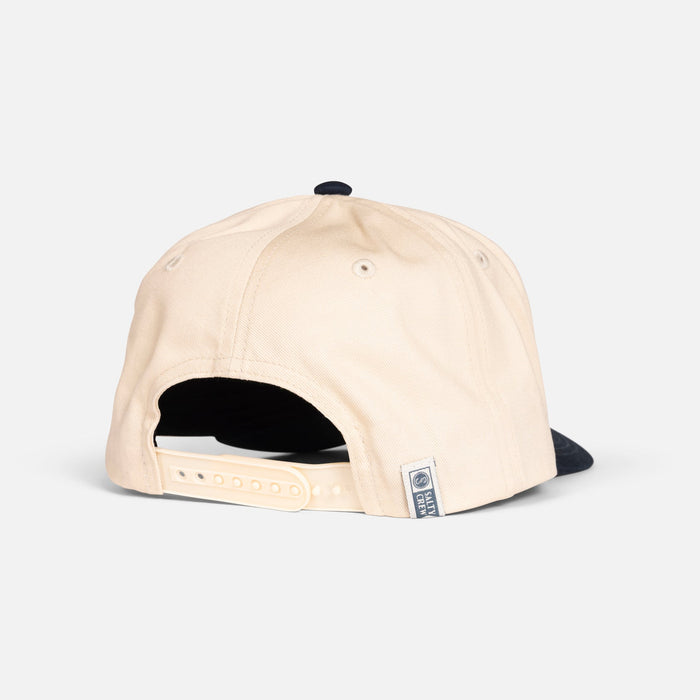 Back view of the Salty Crew Coordinates snapback hat in off white and navy
