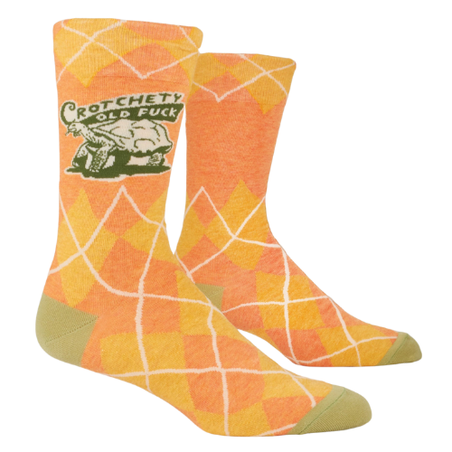 Blue Q socks featuring the bold phrase "Crotchety Old Fuck," with a humorous design for those who embrace their grumpy side.