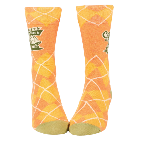Blue Q socks featuring the bold phrase "Crotchety Old Fuck," with a humorous design for those who embrace their grumpy side.