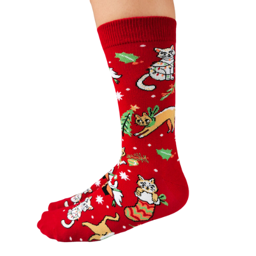 Festive socks from Uptown Sox featuring playful cats in holiday attire, perfect for adding a fun, cozy touch to your winter wardrobe.