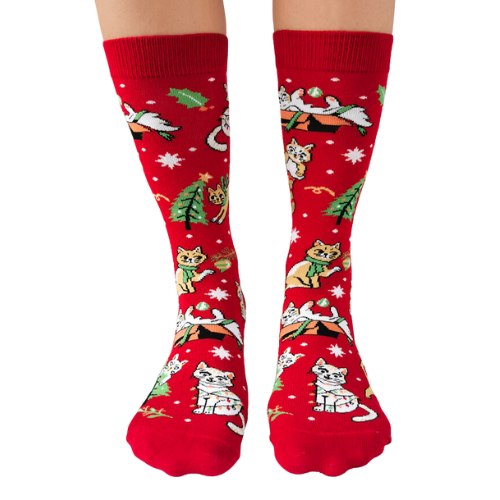 Festive socks from Uptown Sox featuring playful cats in holiday attire, perfect for adding a fun, cozy touch to your winter wardrobe.