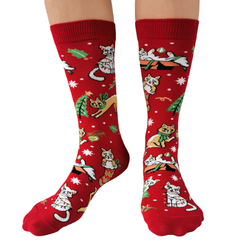 Festive socks from Uptown Sox featuring playful cats in holiday attire, perfect for adding a fun, cozy touch to your winter wardrobe.