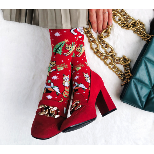 Festive socks from Uptown Sox featuring playful cats in holiday attire, perfect for adding a fun, cozy touch to your winter wardrobe.