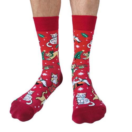 Red festive socks featuring playful holiday-themed cats, gifts, and holly designs