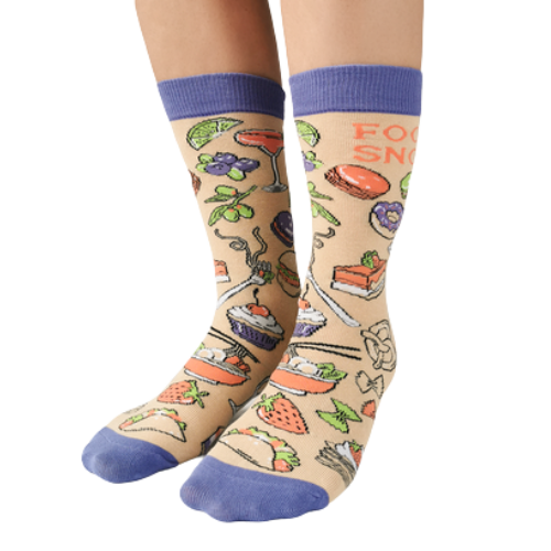 Food Snob Women's Crew Socks. Pilates? Thought you said pie and lattes!  ──────────────── Size Women's shoe size 6-9 Men’s shoe size 4-7 EUR 37-41 ──────────────── Materials & Attributes 70% Combed Cotton, 28% Nylon and 2% Spandex. Reinforced stitching on toe to protect from wear.  Print on Socks: "Food Snob"  ──────────────── Care Machine wash and hang to dry.  Do not iron or bleach.