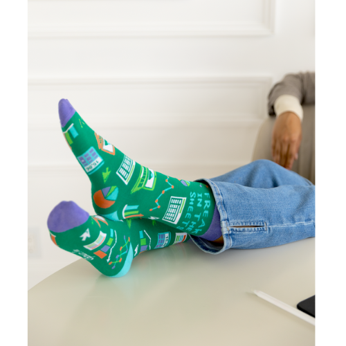 A close-up of Uptown Sox's Freak in the Sheets socks, showing a playful design with colorful sheets and quirky details. Perfect for those with a fun sense of humor.