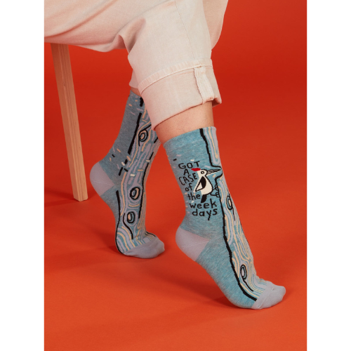 A pair of Blue Q socks with the phrase "Got a Case of the Weekdays," featuring fun graphics and a playful design for those who feel personally attacked by Mondays.
