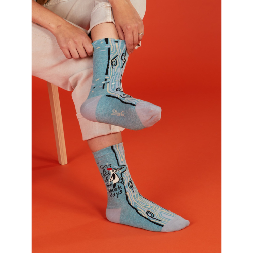 A pair of Blue Q socks with the phrase "Got a Case of the Weekdays," featuring fun graphics and a playful design for those who feel personally attacked by Mondays.