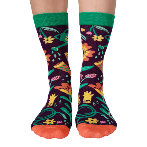 Women's crew socks with colorful gardening-themed designs including flowers, boots, and a watering can from Uptown Sox.