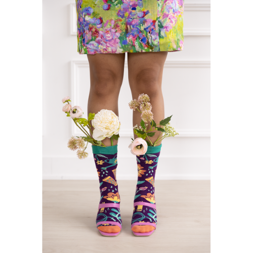 Women's crew socks with colorful gardening-themed designs including flowers, boots, and a watering can from Uptown Sox.