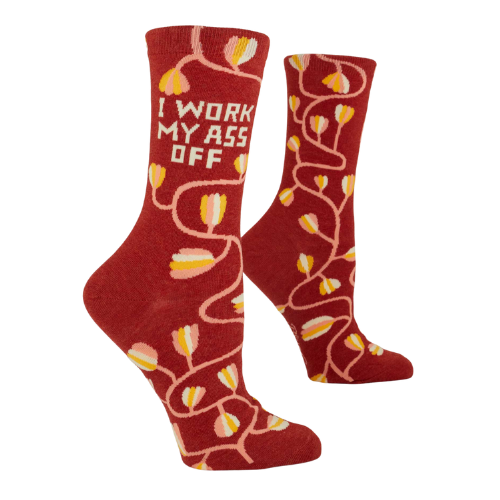 A pair of Blue Q socks with the phrase 'I Work My Ass Off' in bold letters, featuring a fun, colorful design for hardworking personalities.