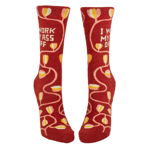 A pair of Blue Q socks with the phrase 'I Work My Ass Off' in bold letters, featuring a fun, colorful design for hardworking personalities.