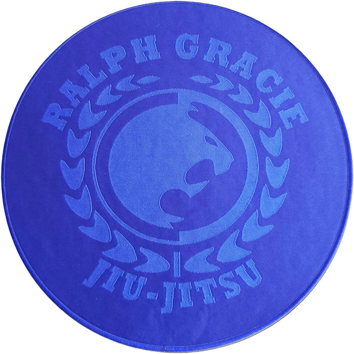 Blue circular mat with 'Ralph Gracie Jiu-Jitsu' branding on a white background