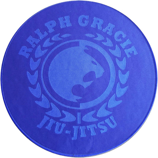 Blue circular mat with 'Ralph Gracie Jiu-Jitsu' branding on a white background