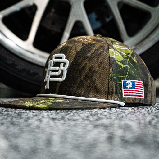 PB Crest rope snapback hat in camo with flat brim, alternate product view of the hat