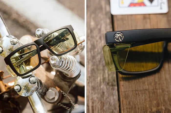 Heat Wave Performance Vise Z87+ Easy Rider 2.0 safety sunglasses shown on a motorcycle handlebar, with a close-up of the temple detail