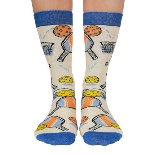 Pickleball-themed socks with vibrant patterns, perfect for players, featuring paddles and balls from Uptown Sox.