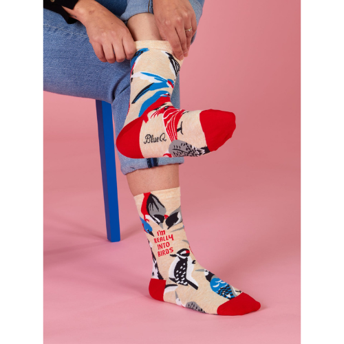 Blue Q crew socks with colorful birds and the phrase 'I'm Really Into Birds' printed on them.