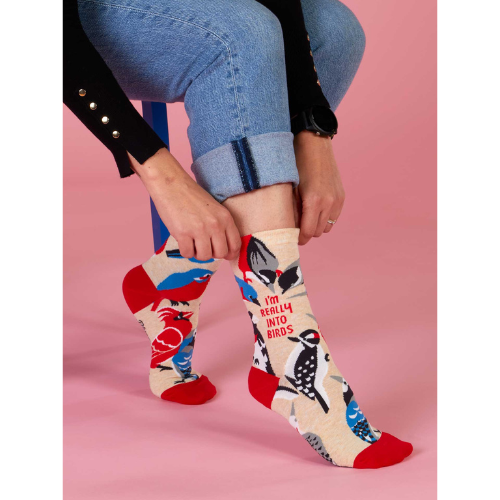 Blue Q crew socks with colorful birds and the phrase 'I'm Really Into Birds' printed on them.