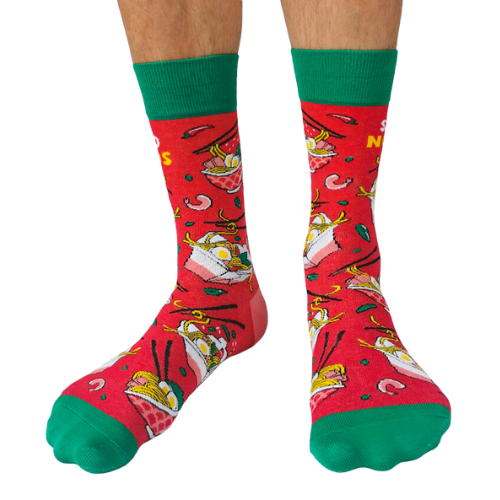 Pair of red men's crew socks with green accents, featuring a noodle bowl design and the phrase 'Send Noods,' decorated with chopsticks and noodle imagery.
