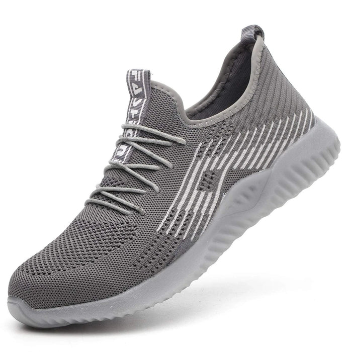 Grey steel toe cap safety sneaker — side profile view showing breathable mesh upper and rubber outsole