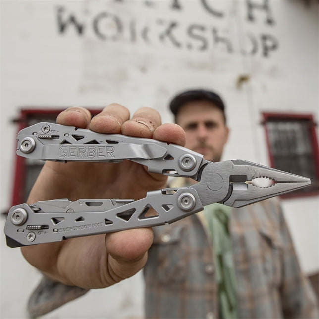 Gerber Suspension NXT multi-tool showing the folded frame and integrated pocket clip
