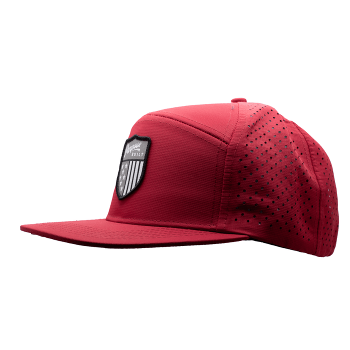The Badge water resistant hat in red, left three-quarter view