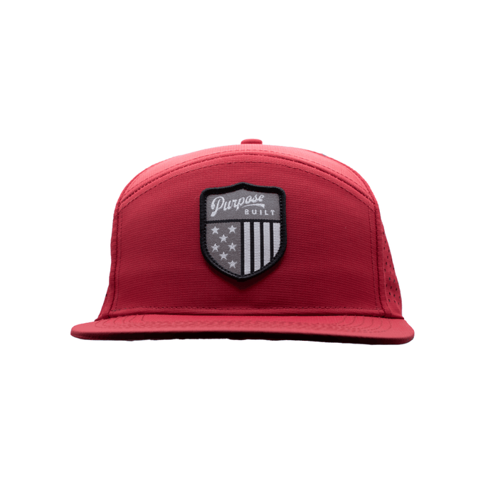 The Badge water resistant hat in red, front view of the badge patch