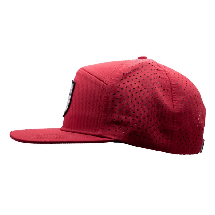 The Badge water resistant hat in red, side view