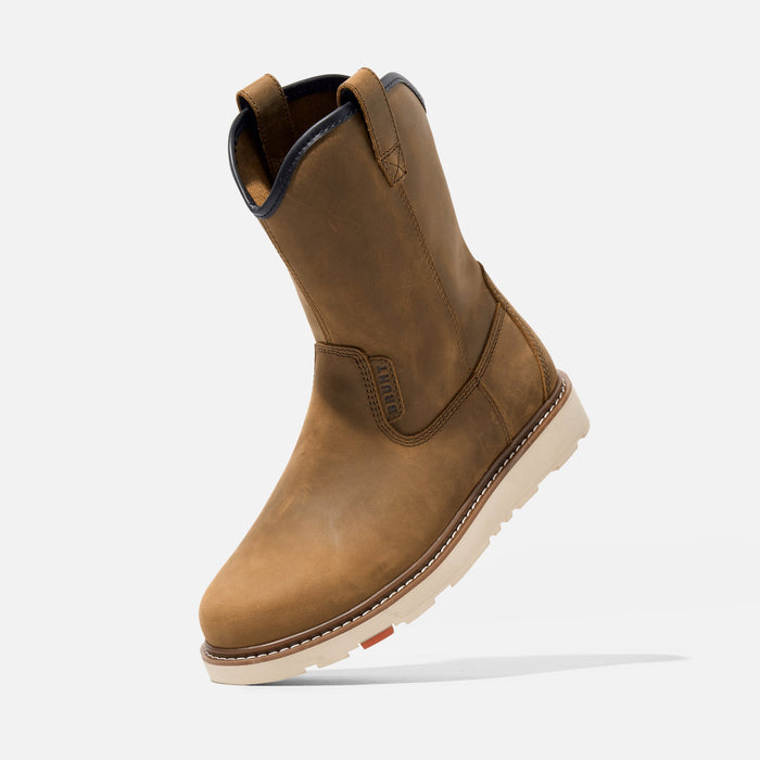 Composite toe pull on work boot by BRUNT in brown shown mid-step in a job site setting
