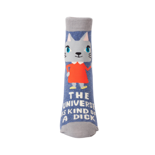 crew socks featuring the phrase “The Universe Is Kind Of A Dick” in bold lettering, designed by BlueQ.