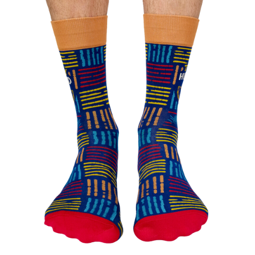 A pair of socks with a playful design featuring bold text that reads "Trophy Husband" in large, gold and white capital letters. The background is a deep, vibrant blue with small, scattered trophy icons in yellow and gold, adding a fun, humorous touch. The socks are mid-calf length and made of soft, stretchy material, perfect for a quirky gift or personal wear.