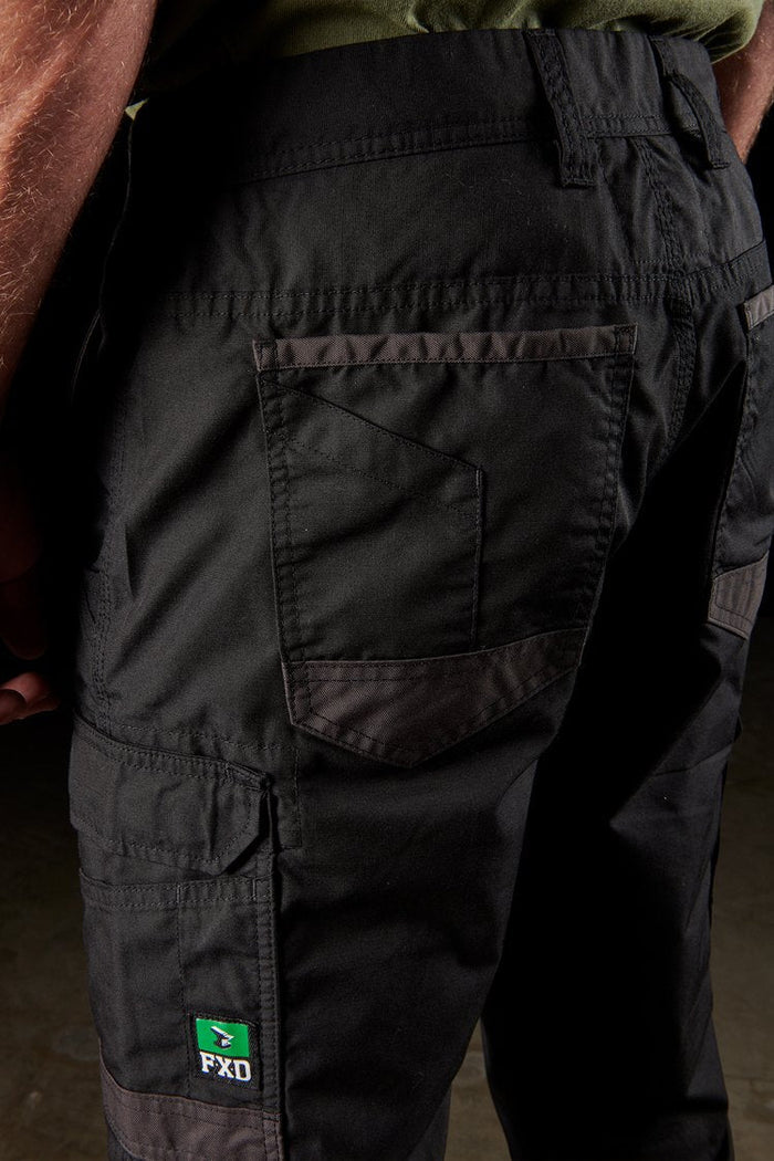 Detail view of the FXD WP5 black cargo pant showing the pocket construction