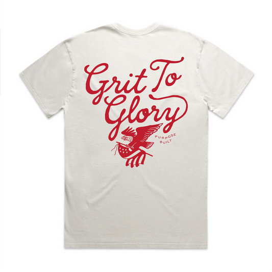 Youth Grit to Glory interlock short sleeve tee in white, main product view of the front print