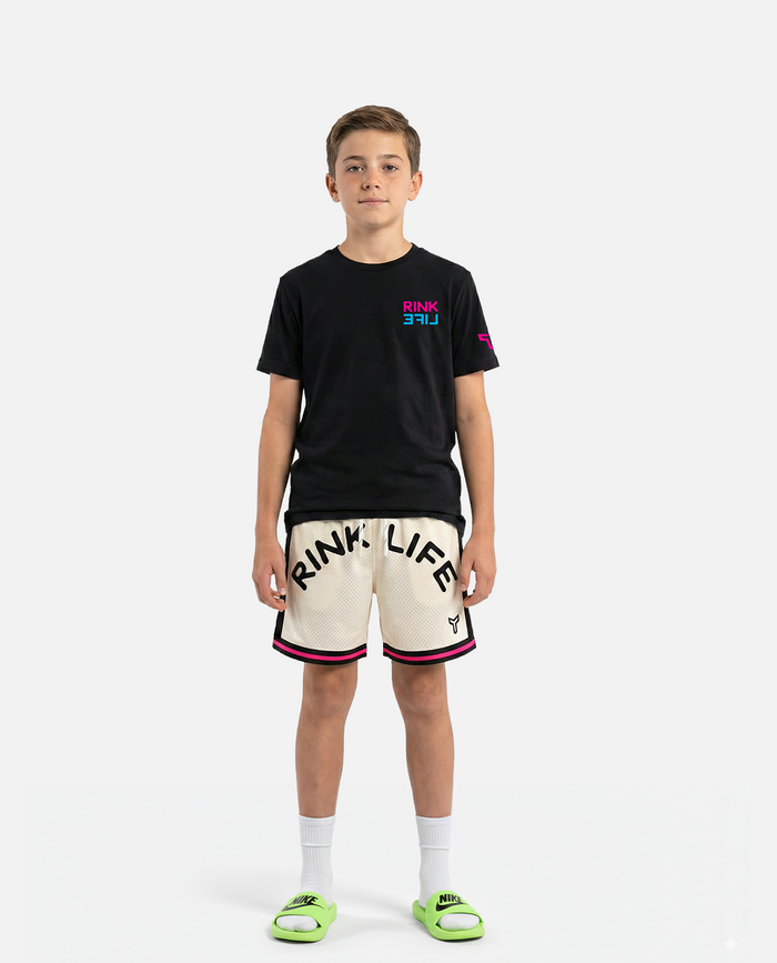 Young person wearing a titan battlegear black t-shirt and white titan battlegear shorts rink life text